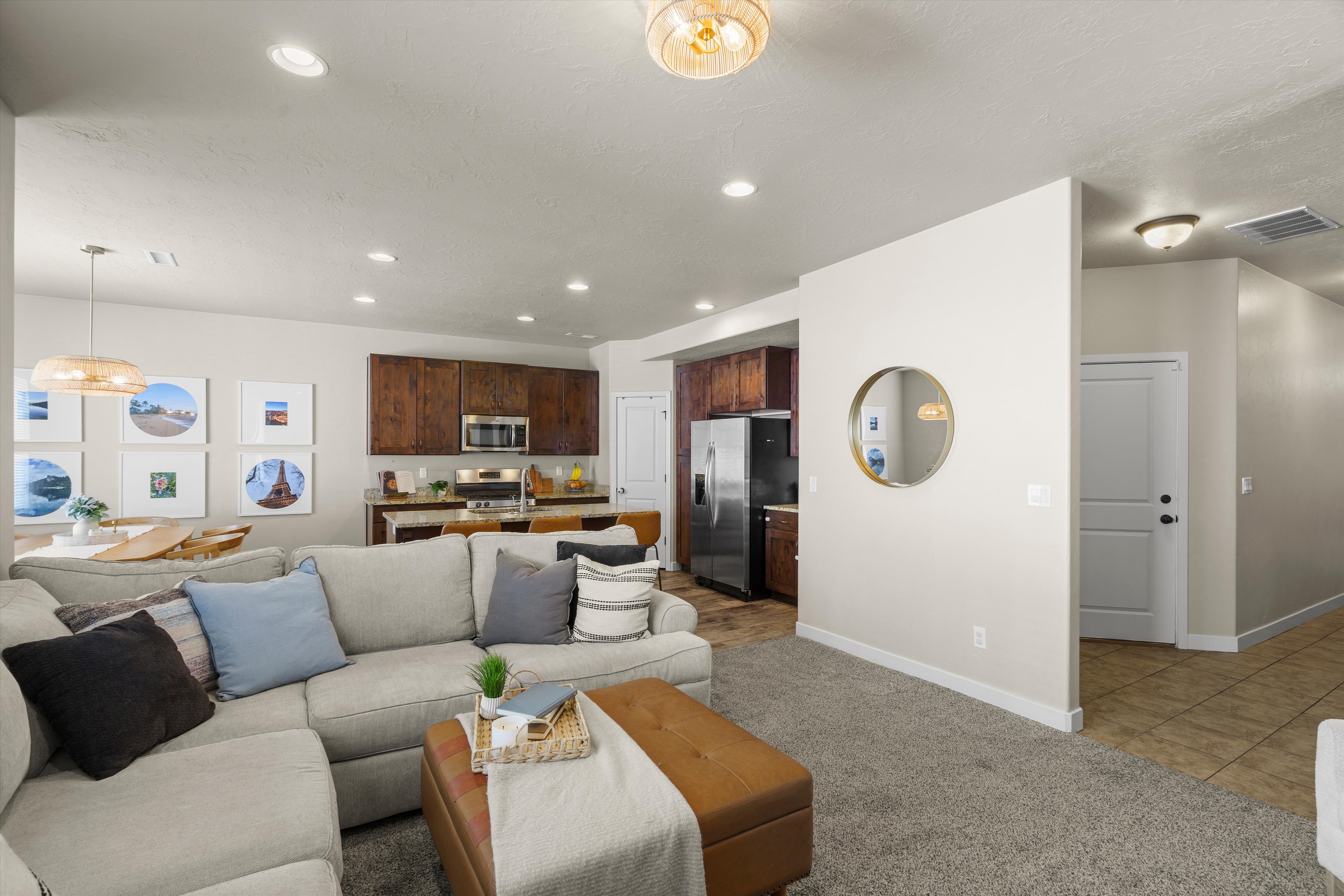 Spacious living area featuring recessed lighting and plush carpeting
