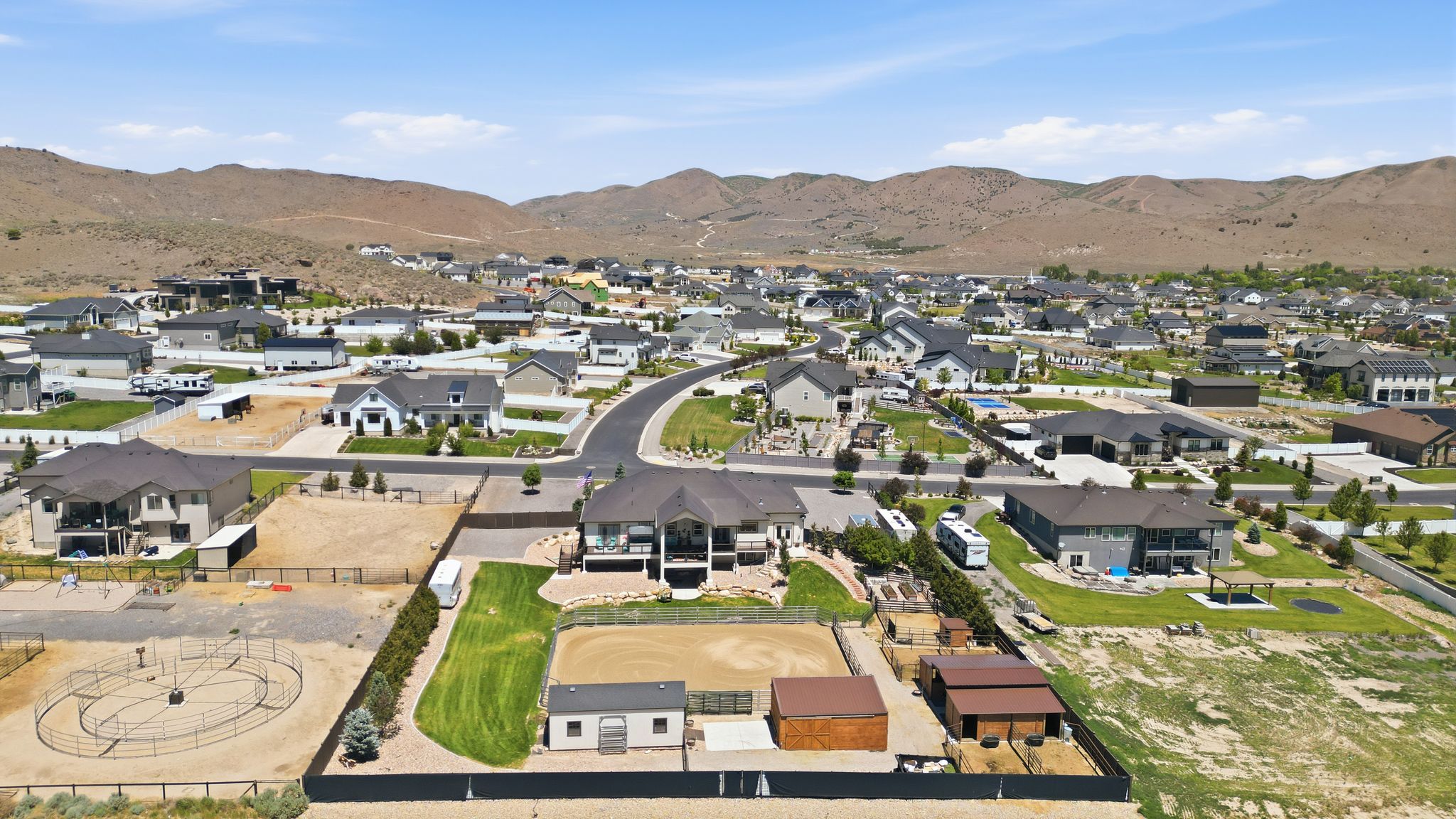 Expansive property featuring an equestrian arena, stables, and a dedicated turnout area