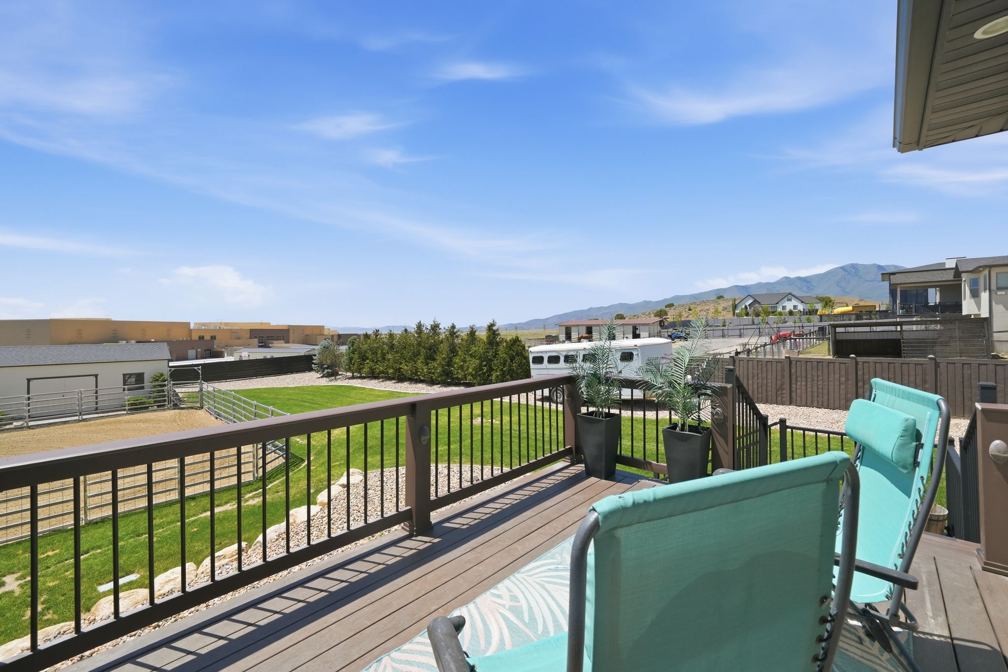 Expansive outdoor deck featuring composite decking and a black metal railing