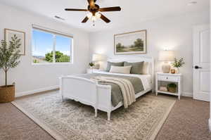 Bright room featuring a large window with outdoor scenery, carpet flooring, and a ceiling fan with integrated lighting