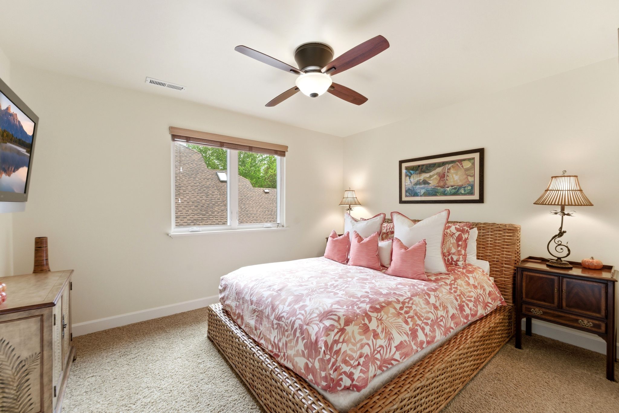 Carpeted room featuring a ceiling fan with integrated lighting, a double window with wood-finish blinds, and light-toned walls