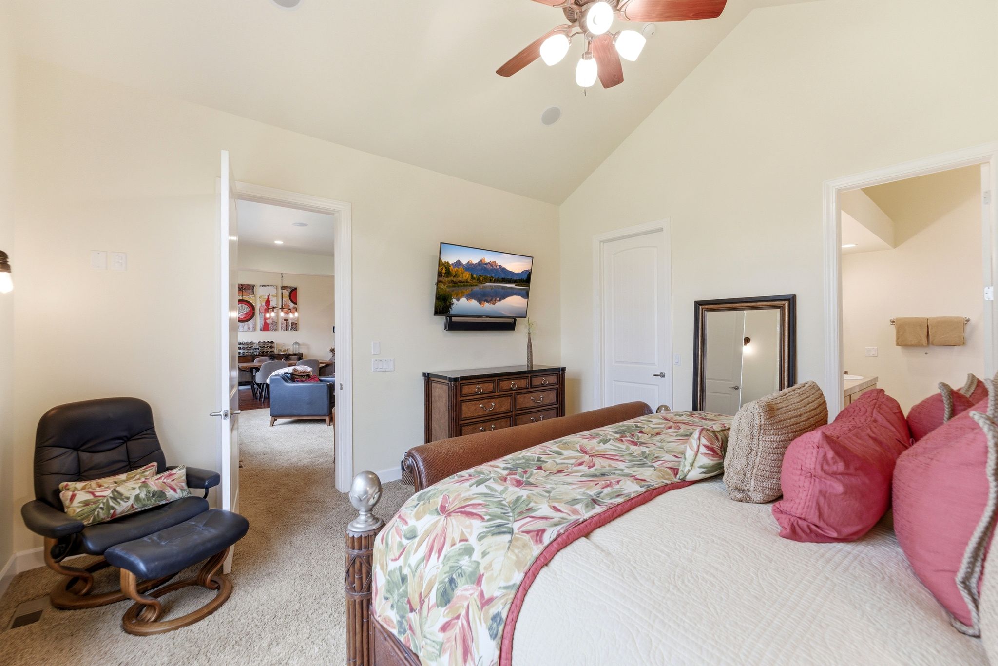 Vaulted ceiling bedroom with a ceiling fan, recessed lighting, and carpet flooring