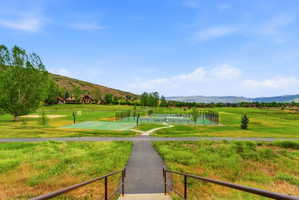 Expansive green space featuring multiple outdoor sports courts, including a basketball court and tennis court Aerial views of Burgi Hill Park adjacent to Valais
