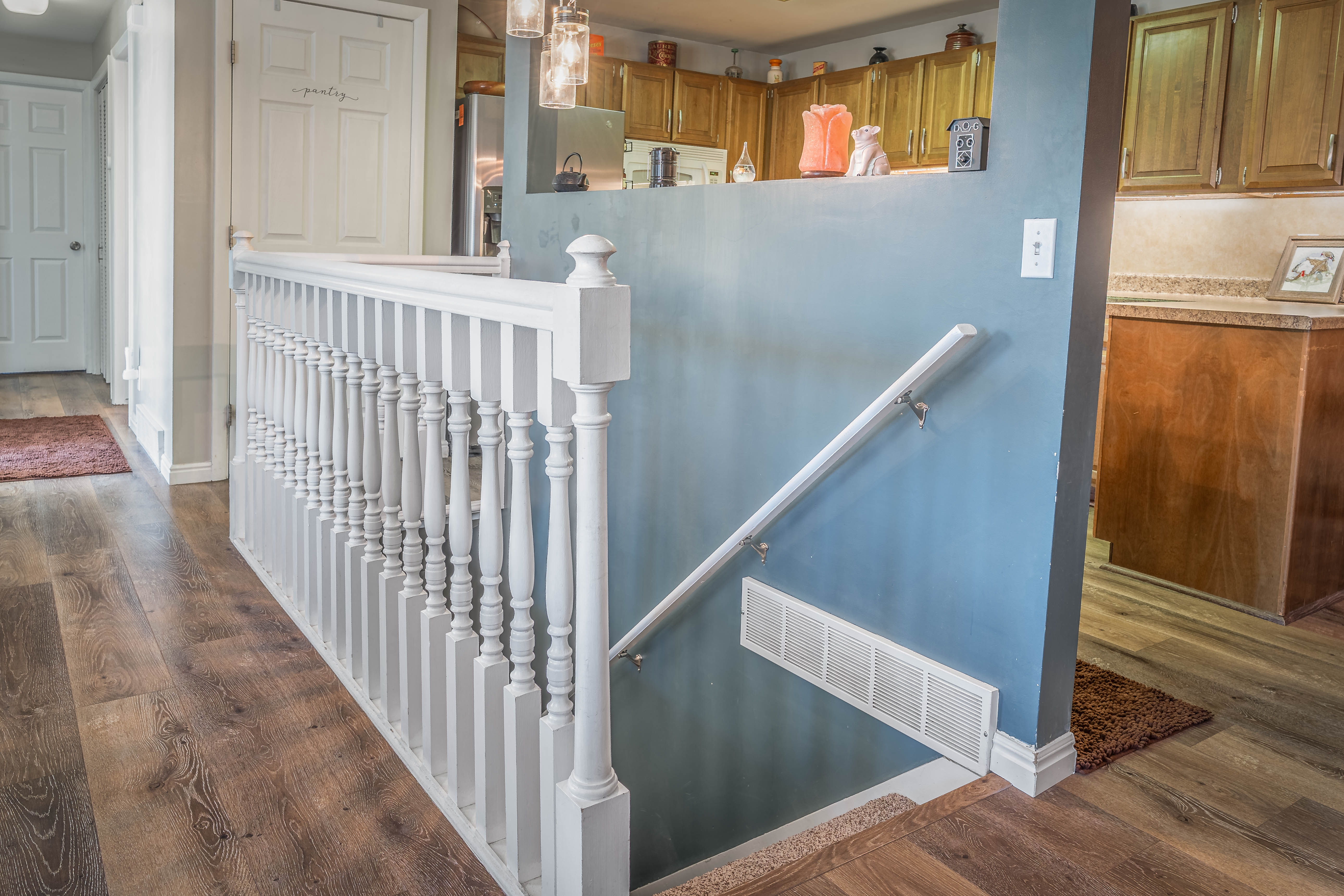 Split-level entry with white balusters and handrail