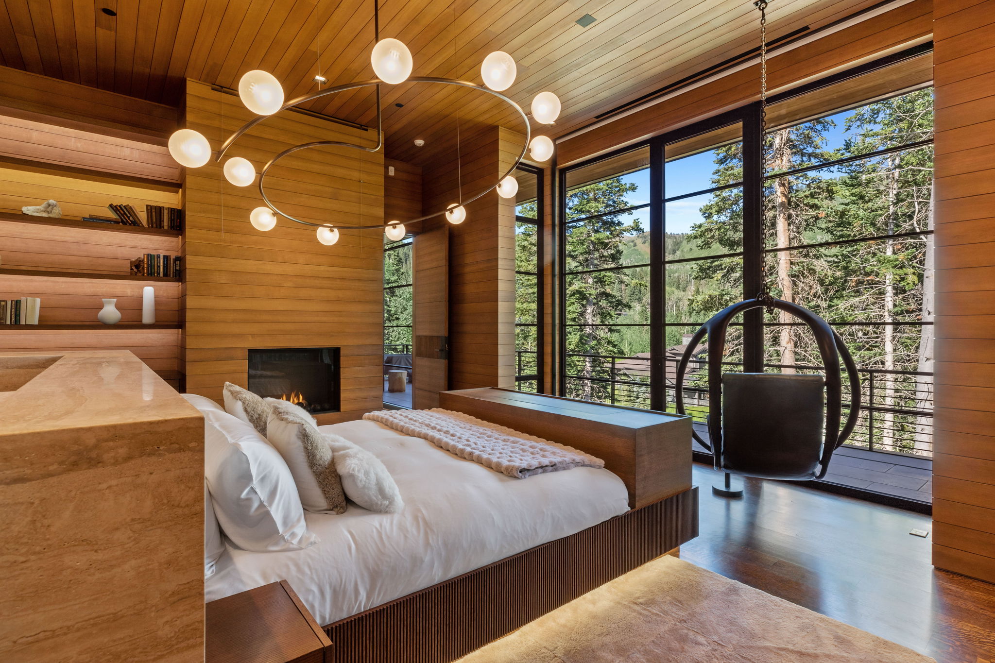 Floor-to-ceiling windows with expansive treeline scenery