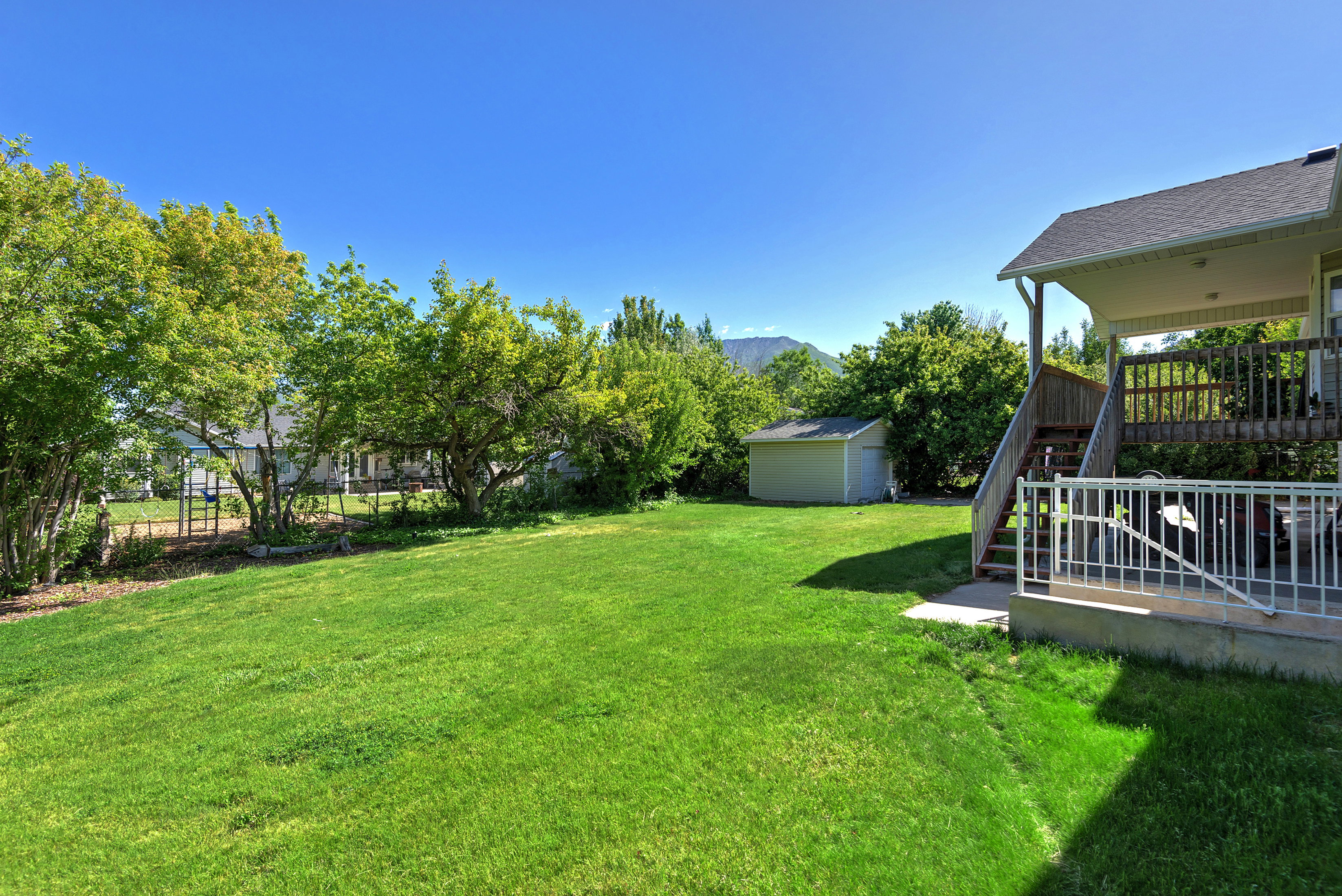 Expansive green lawn providing ample outdoor space