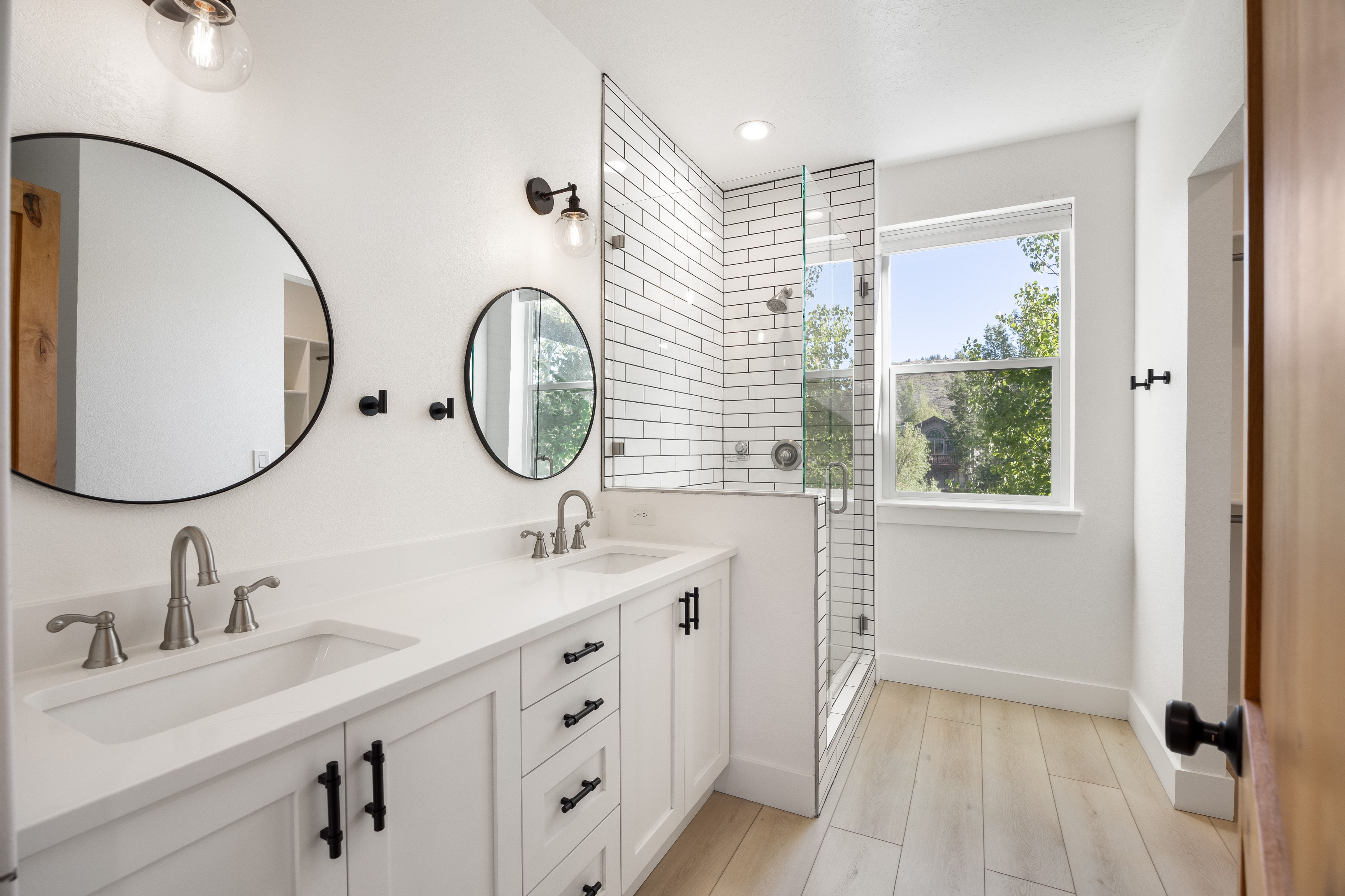 Double vanity with dual undermount sinks and brushed nickel fixtures