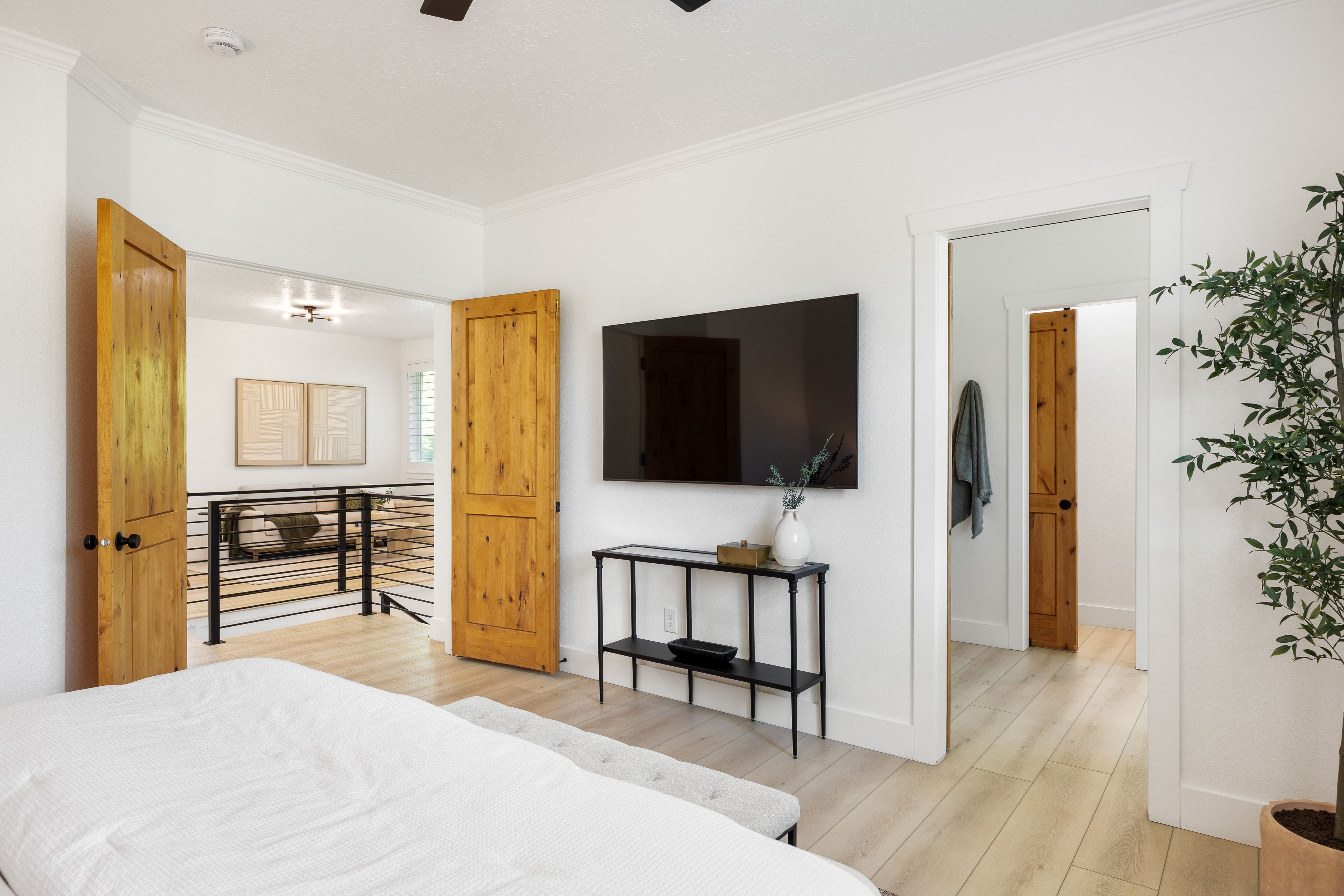Bright interior featuring light wood-finish flooring and white walls