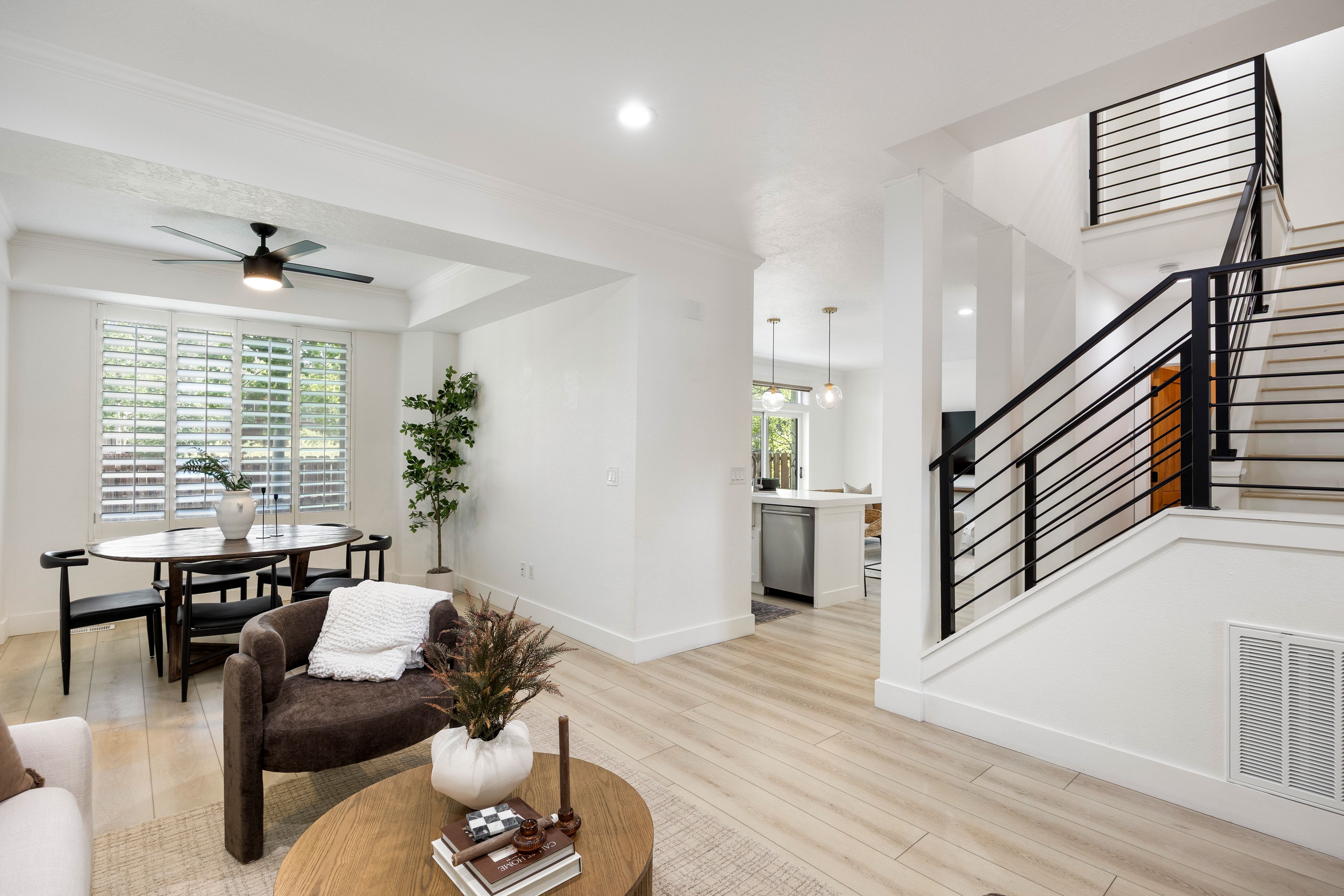 Contemporary interior featuring light wood-finish flooring and white walls