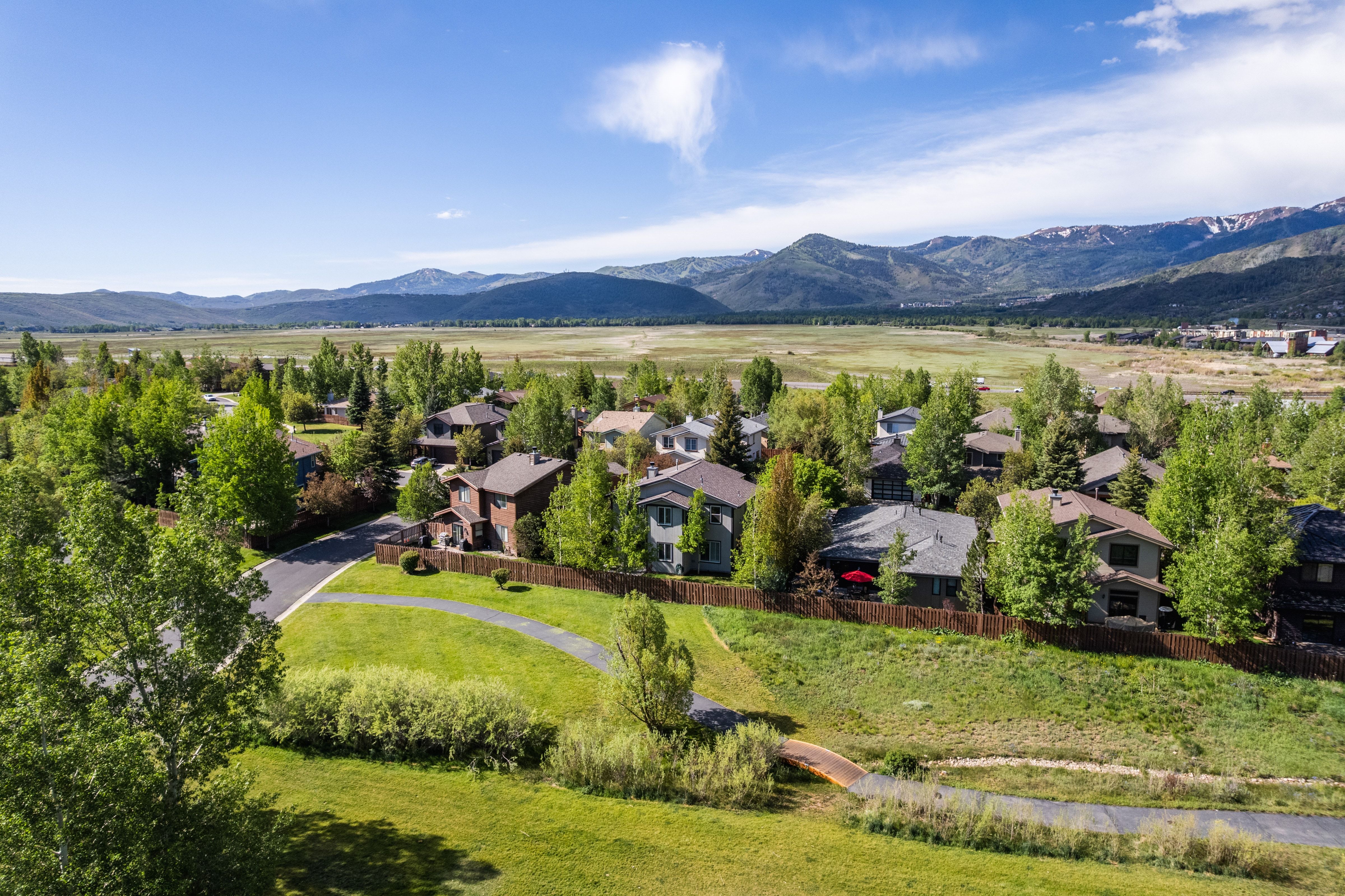 Residential neighborhood featuring varied architectural styles and mature landscaping