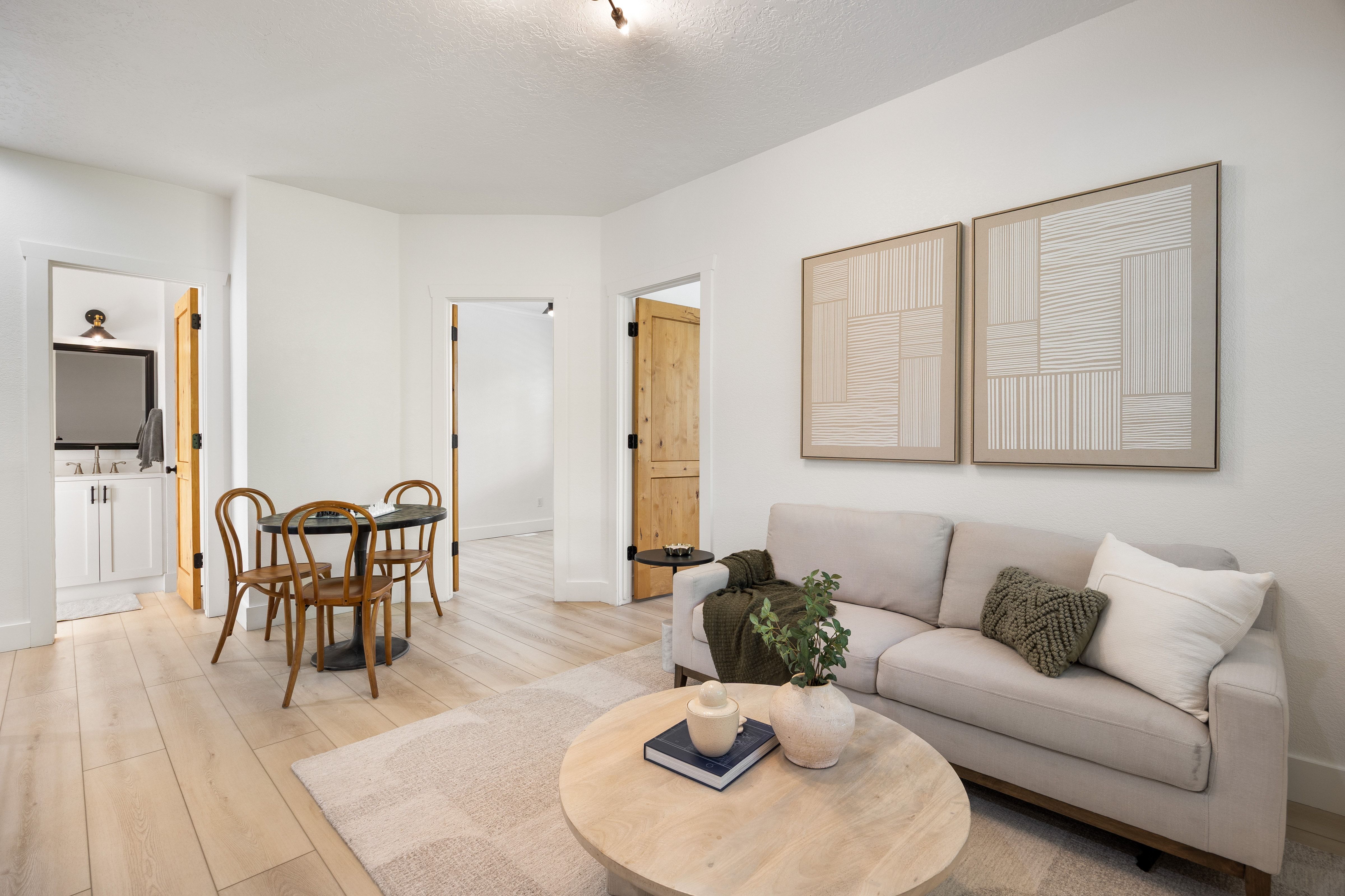 Open concept living space featuring light wood-finish flooring