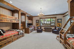 Spacious room featuring multiple built-in bunk beds with integrated storage drawers