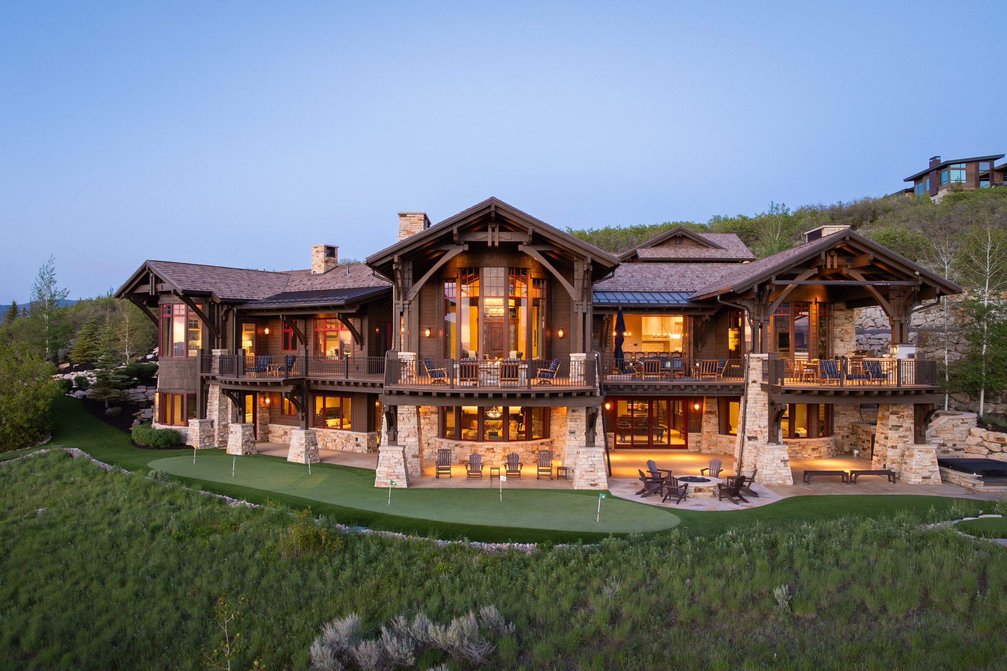 Expansive multi-level property featuring a stone and wood exterior