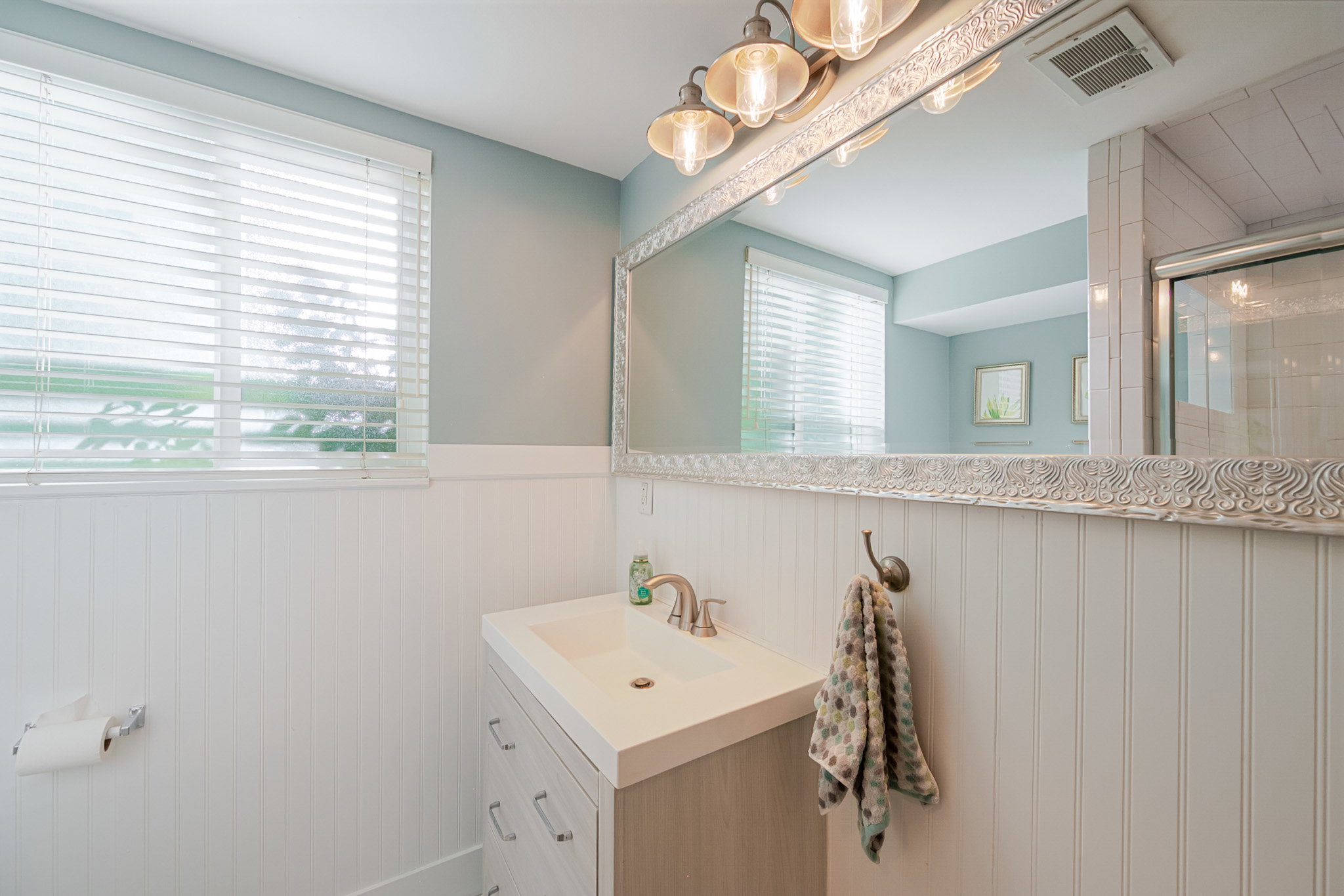 Bright new neutral lower level bath