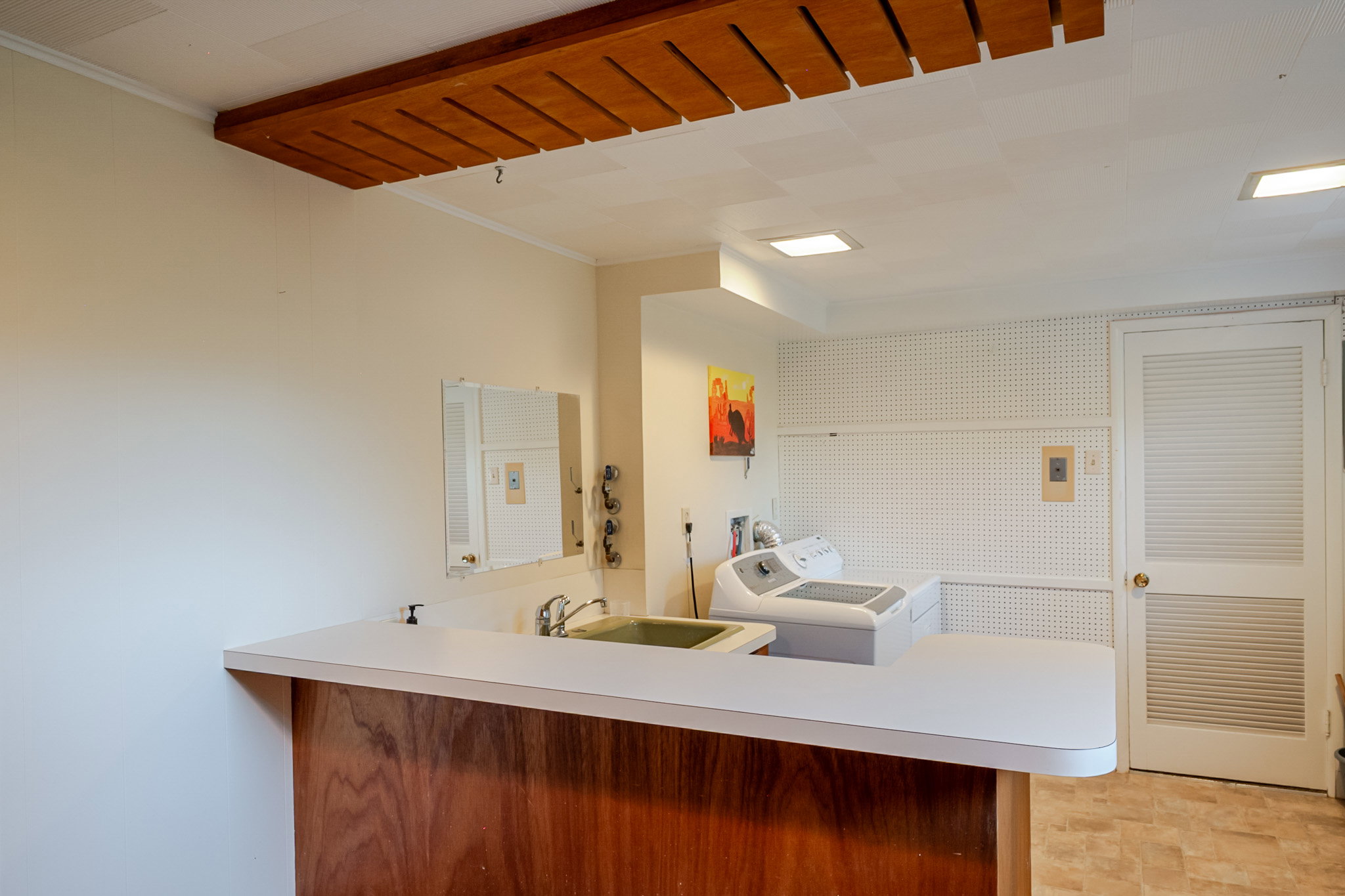 Lower level wet bar/Laundry could easily serve as second kitchen for an ADU.