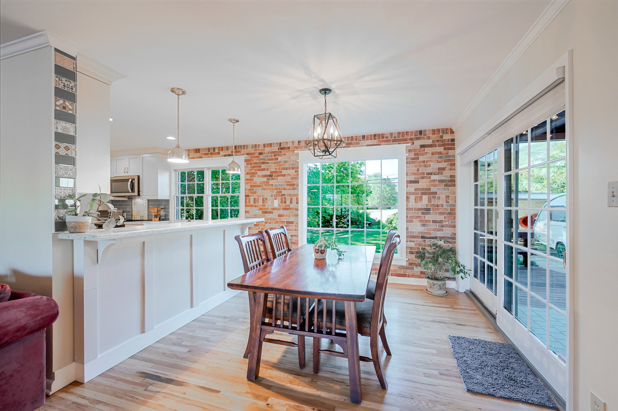 Open kitchen into Dining area featuring hardwood floors