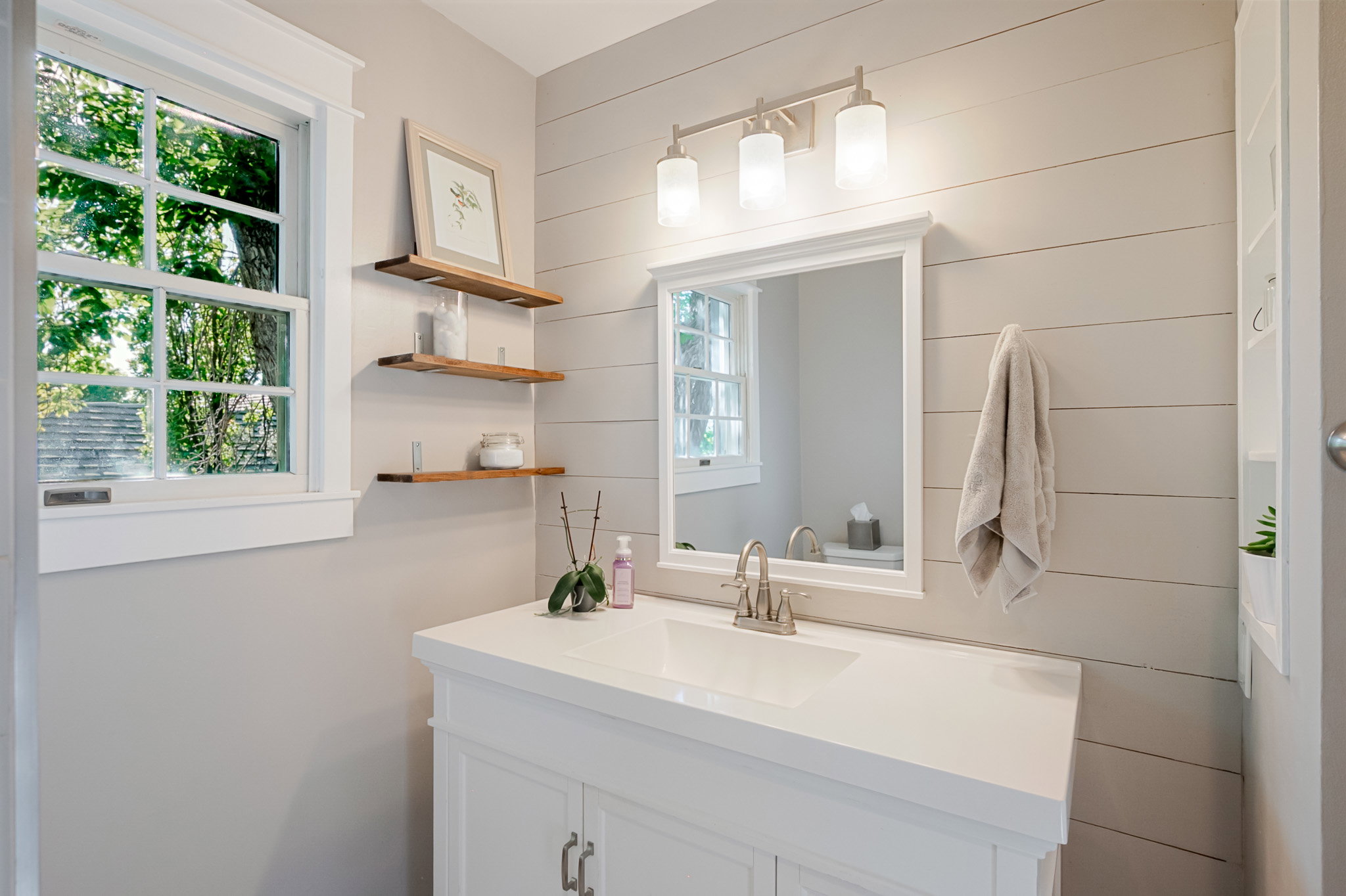 Newer main bath with white vanity