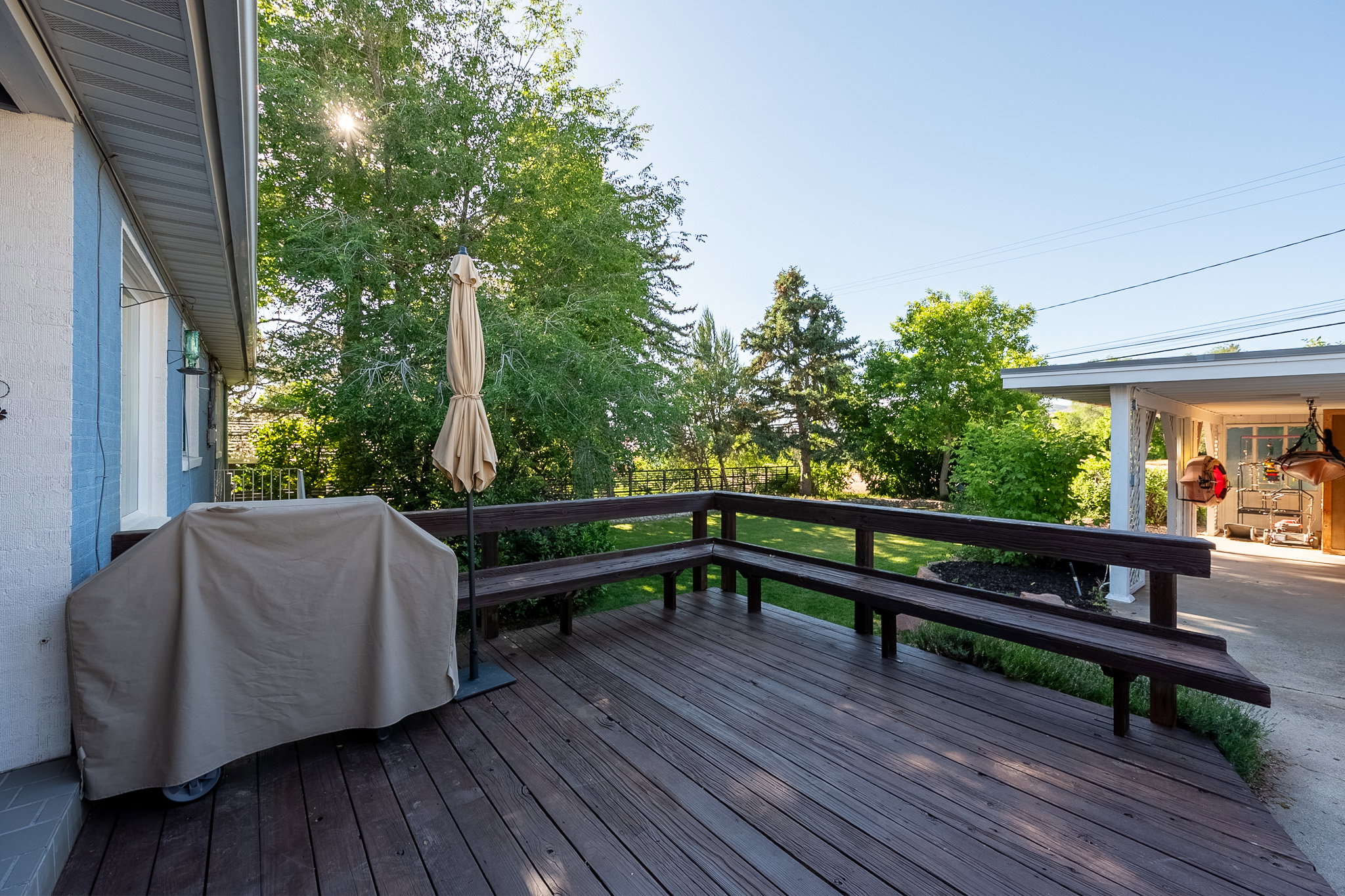 Spacious outdoor deck with built-in bench seating perfect for entertaining
