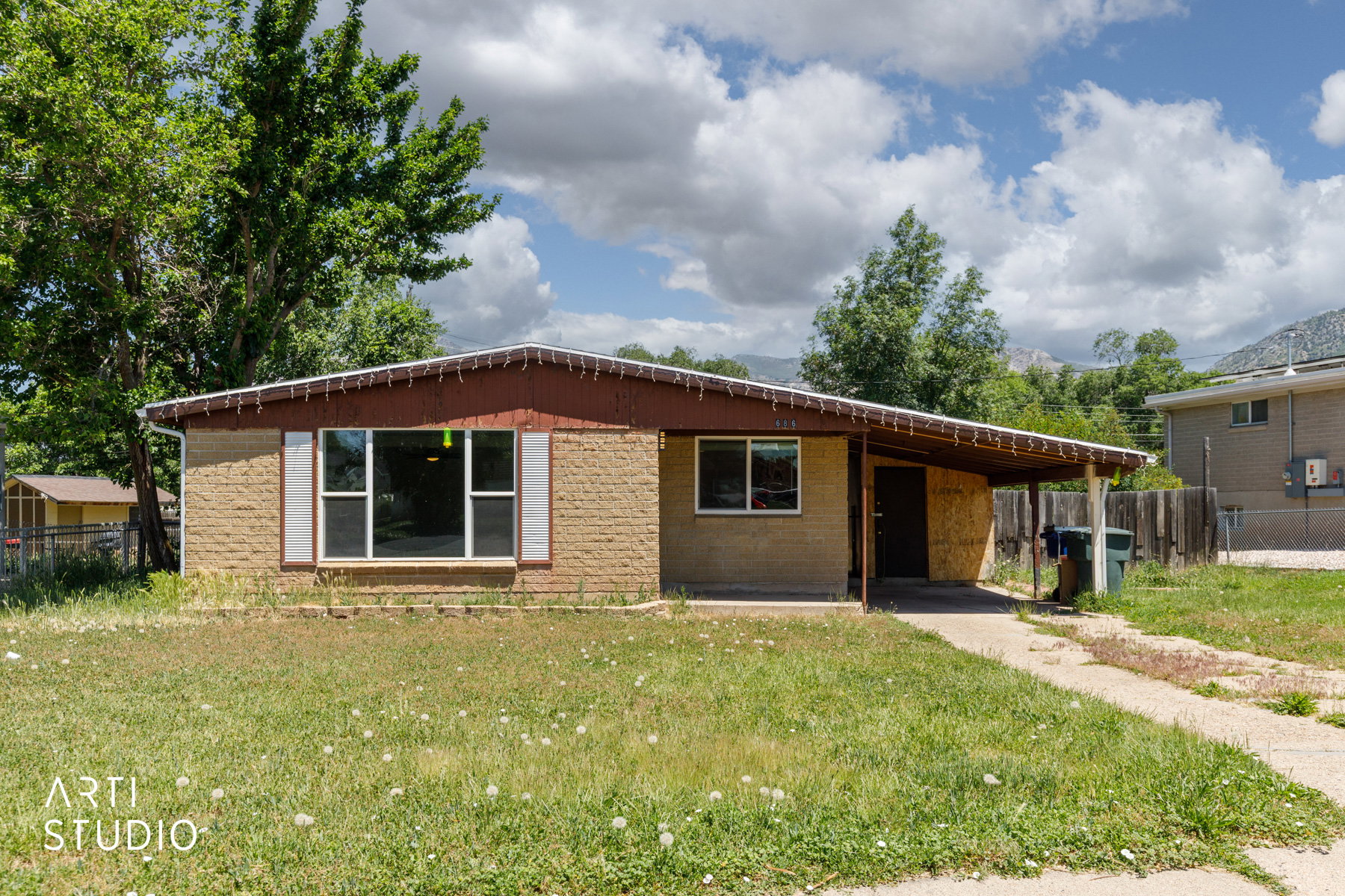 Single-story residence featuring a brick facade with a contrasting dark brown soffit