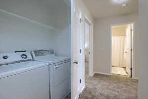 Dedicated laundry area with upper shelving