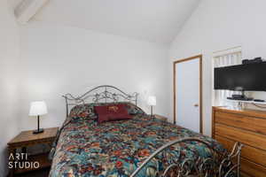 Vaulted white ceiling with exposed beam