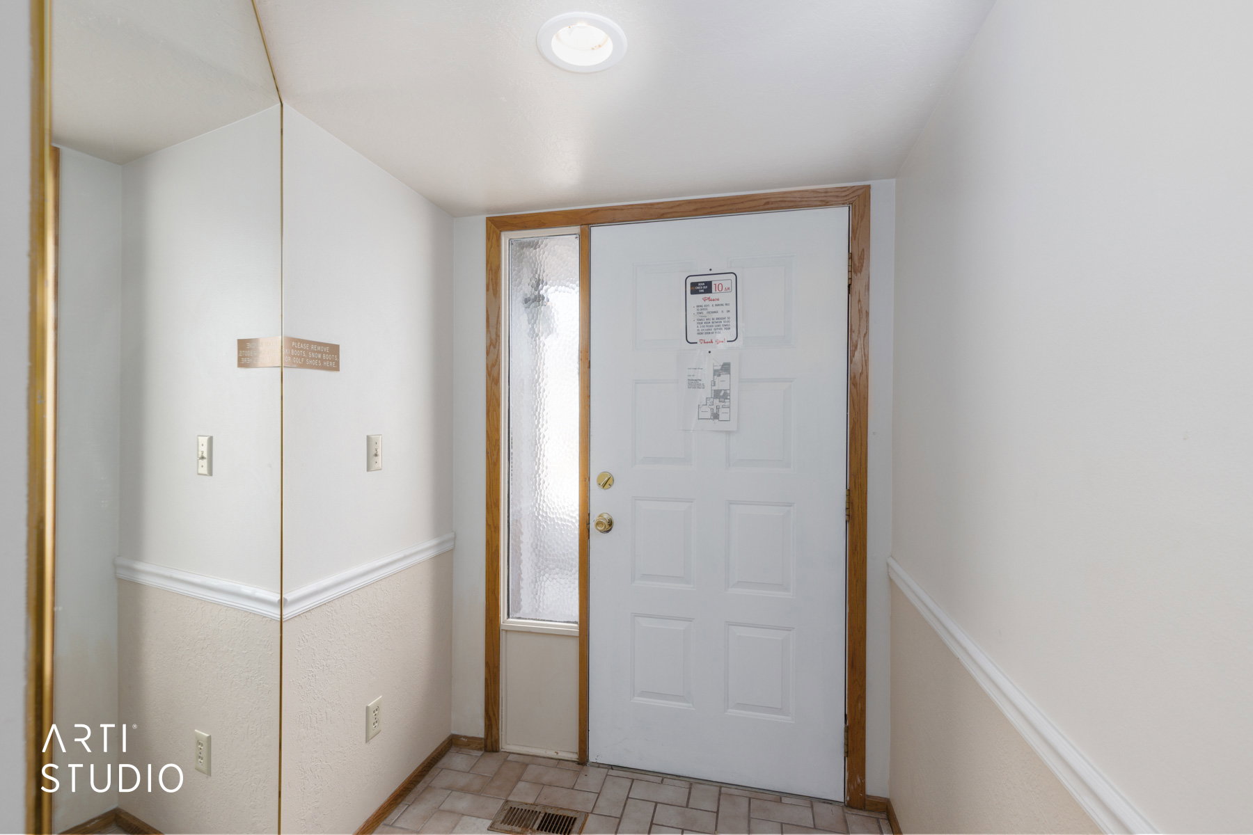Entryway featuring a paneled door with wood trim, a textured glass sidelight, and recessed lighting