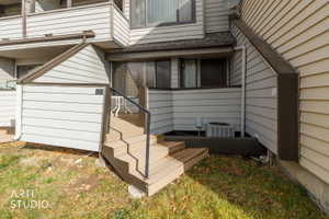 Entryway featuring a multi-level deck leading to a private patio