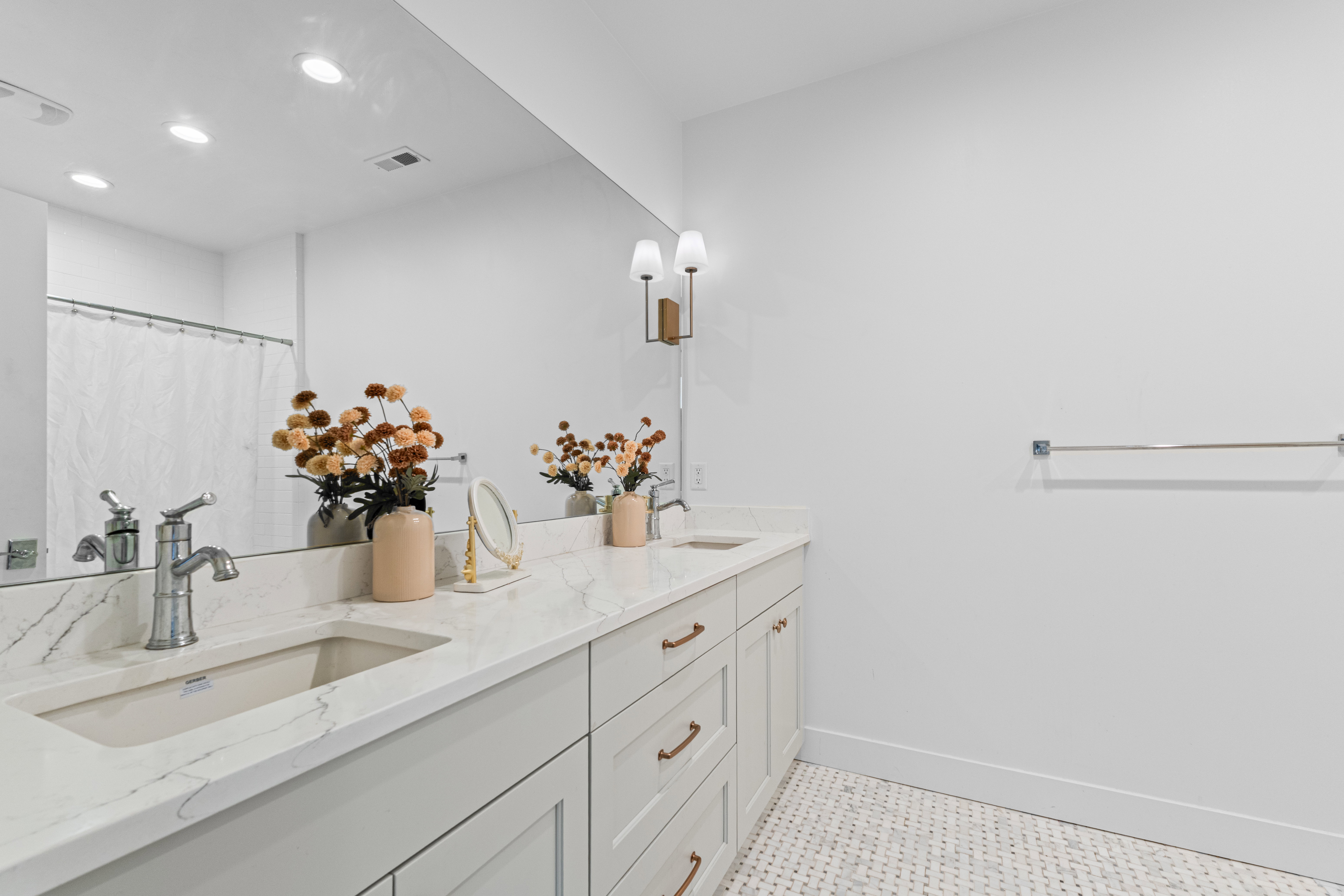 Dual vanity with stone-finish countertop and undermount sinks
