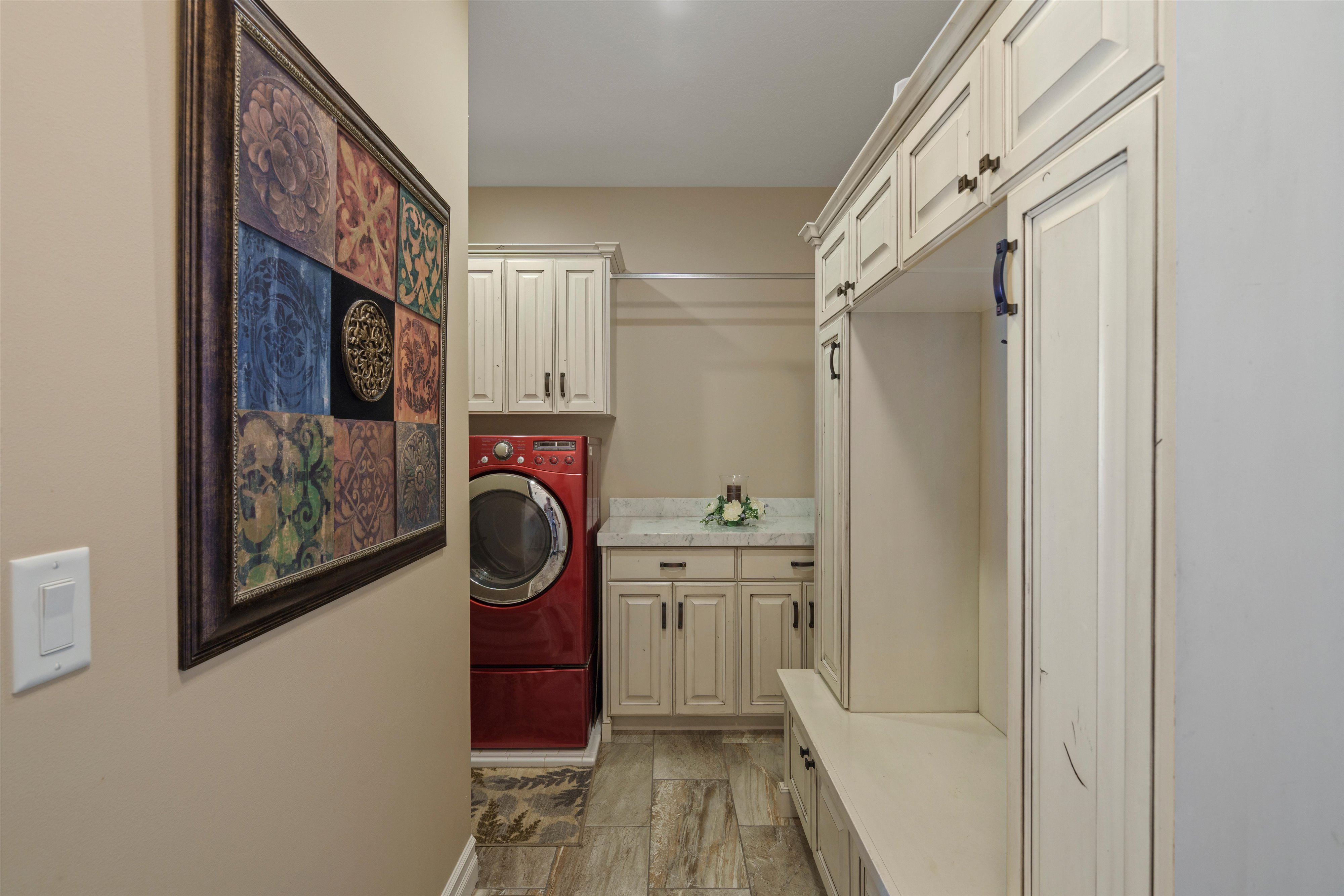 Built-in cabinetry and bench seating featuring overhead storage