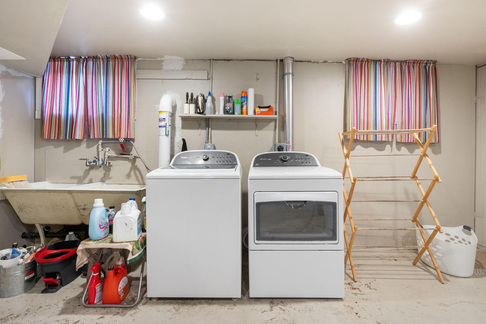 Dedicated laundry area featuring a white washing machine and a white dryer