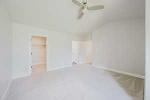 Primary bedroom looking toward walk-in closet and ensuite bath.