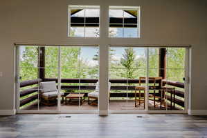 Side by side sliders plus windows near vaulted ceiling bring in lots of natural light and provides great views.