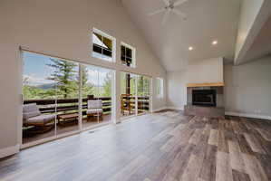 Vaulted ceiling makes living room feel expansive. Fireplace adds ambience.