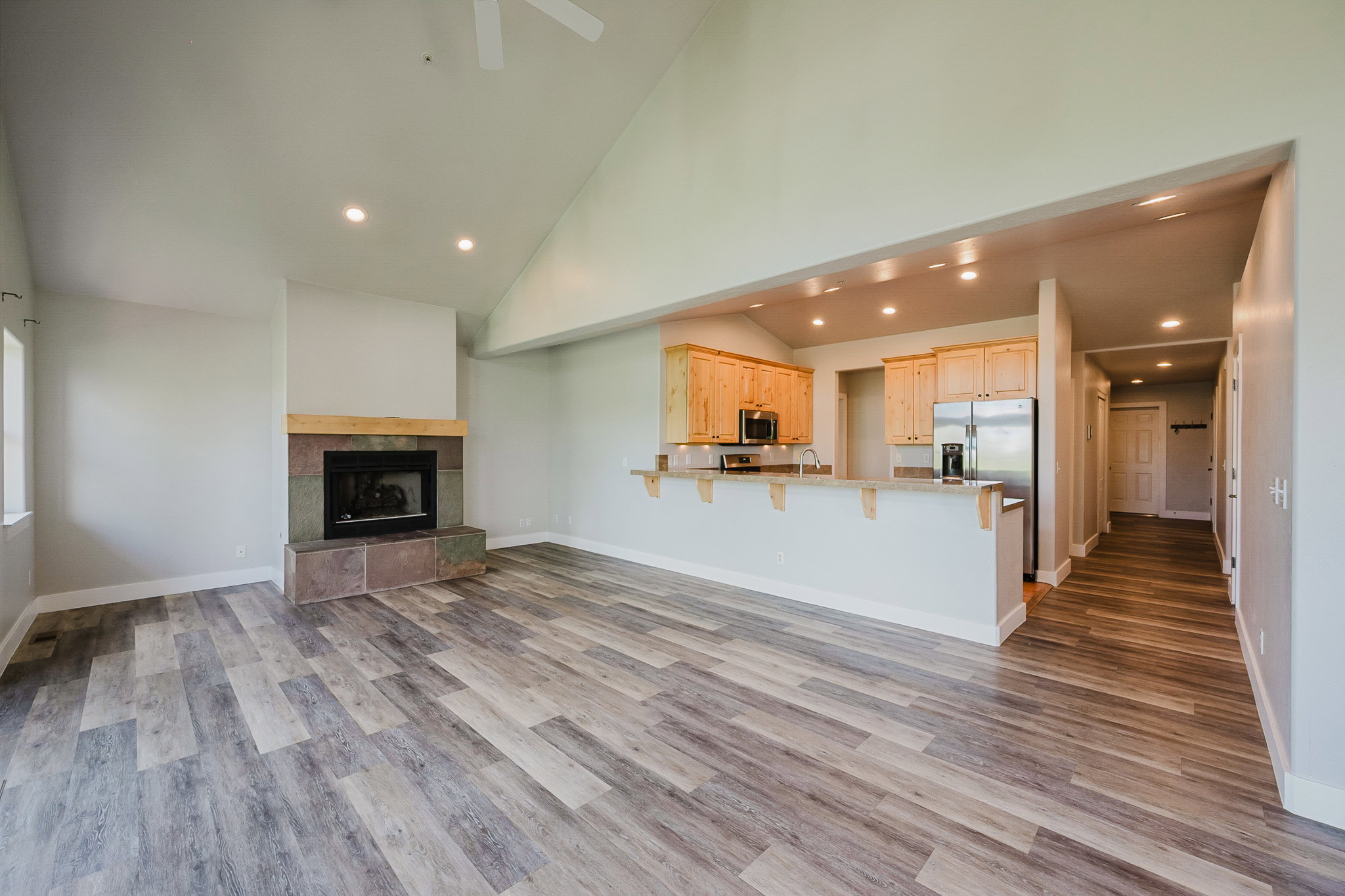 Large living room with vaulted ceilings adds comfort, feels huge