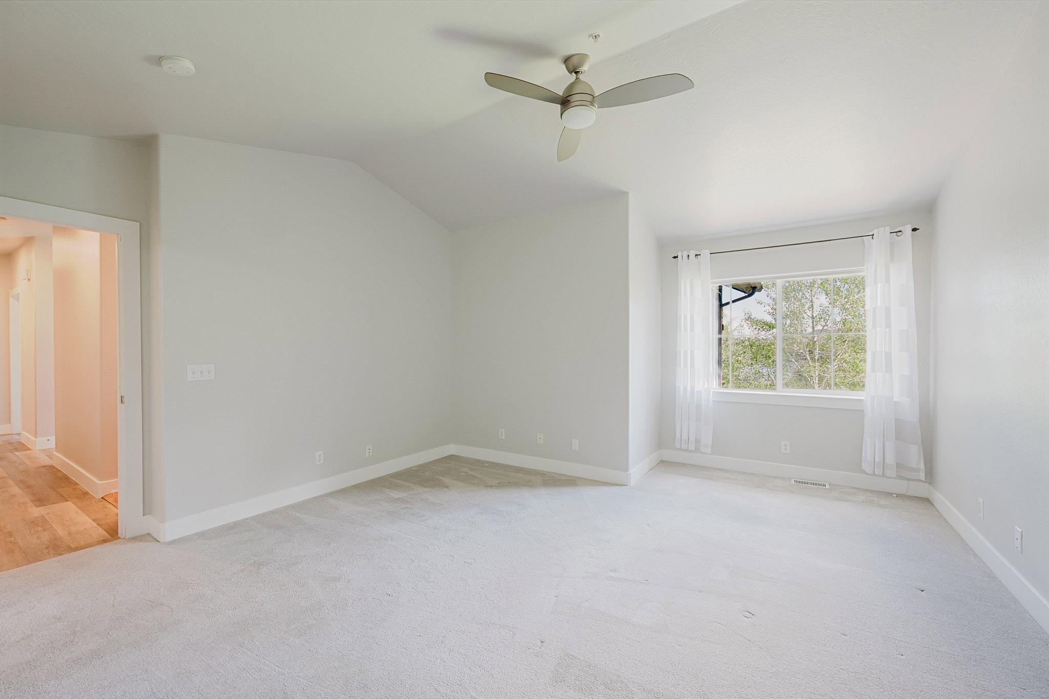 Another view of the primary bedroom.