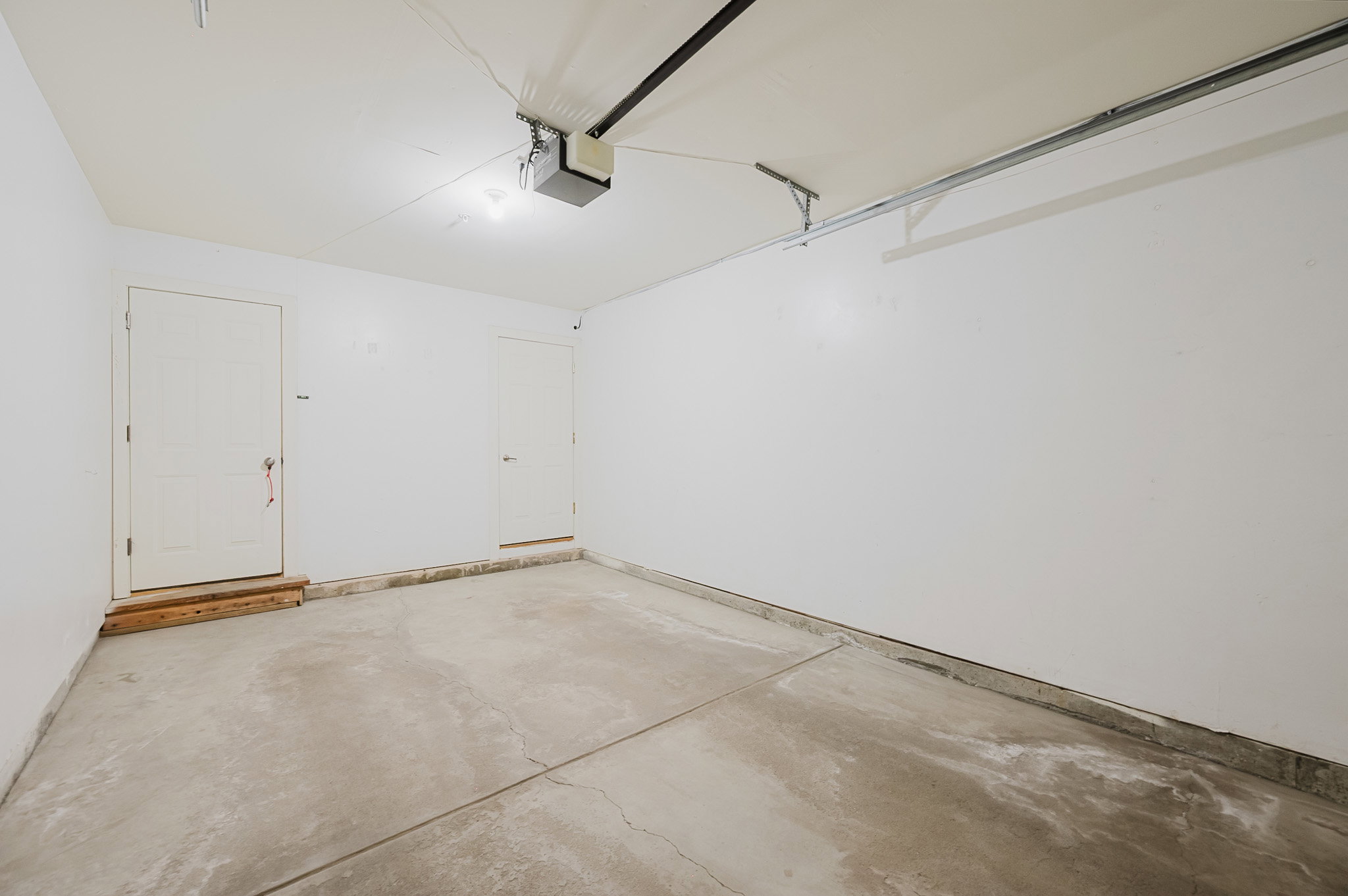 Attached garage. Dedicated parking space outside as well.