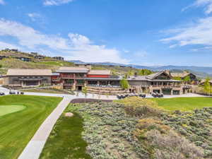 Expansive multi-building complex featuring varied architectural styles and natural stone accents