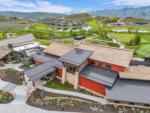 Contemporary architectural design featuring a combination of natural stone and vibrant red siding