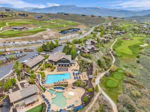 Expansive mountain community featuring multiple swimming pools, a hot tub, and a water slide