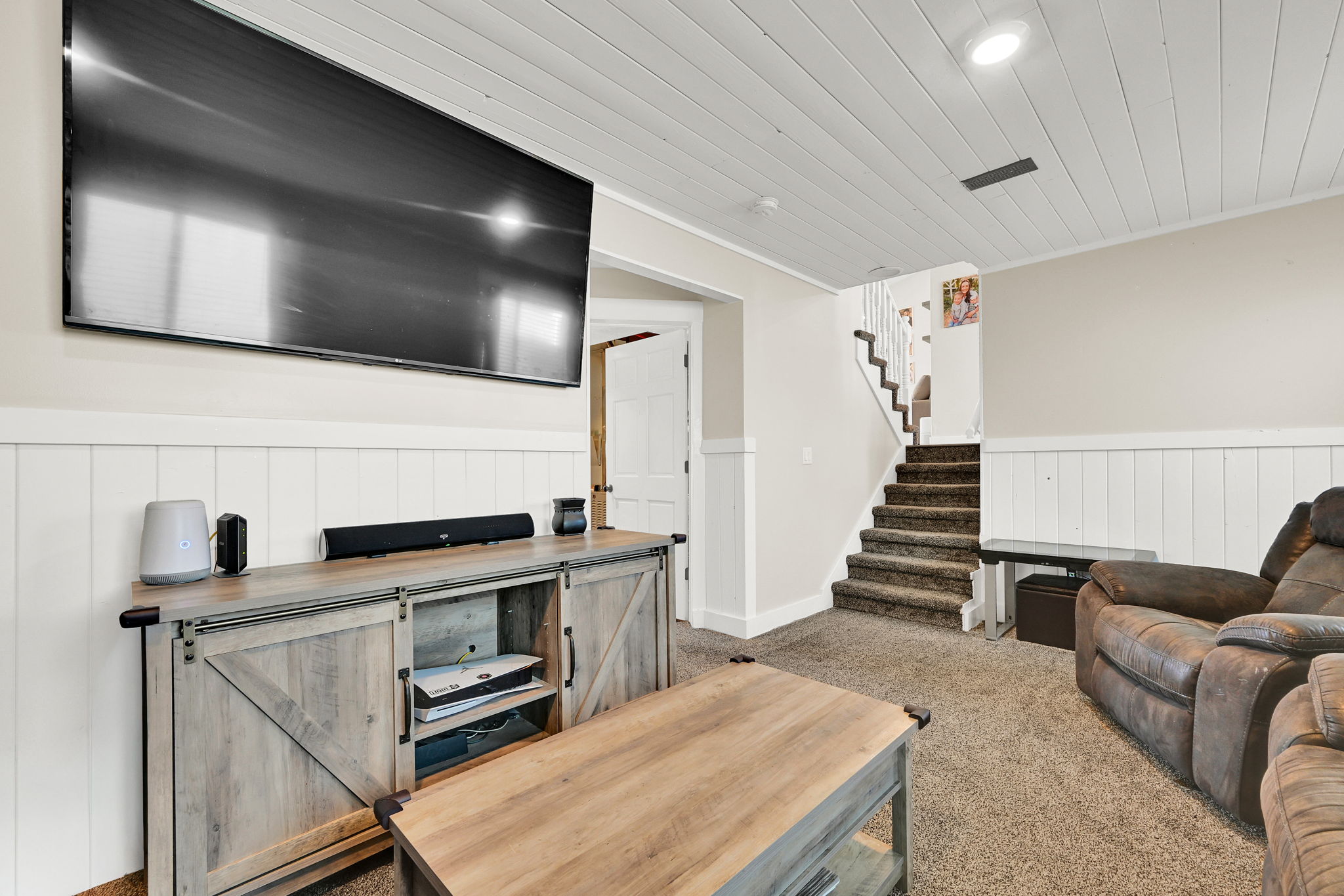 Finished interior space featuring a shiplap ceiling, recessed lighting, and a neutral color palette