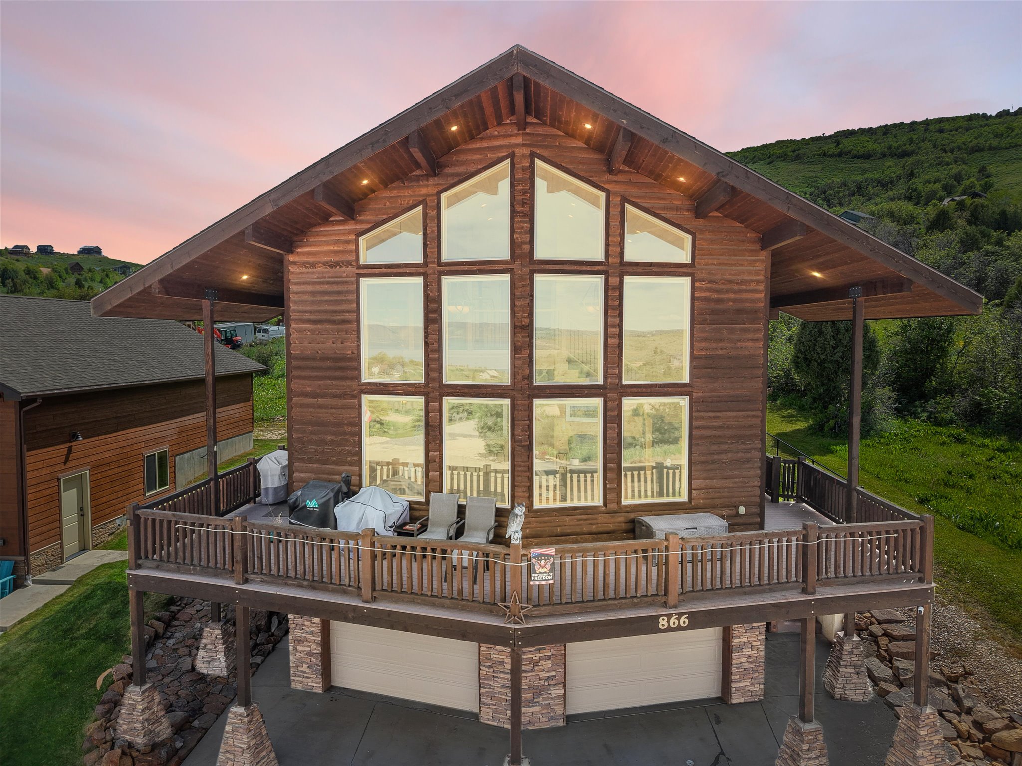 Multi-level home featuring a prominent wall of windows
