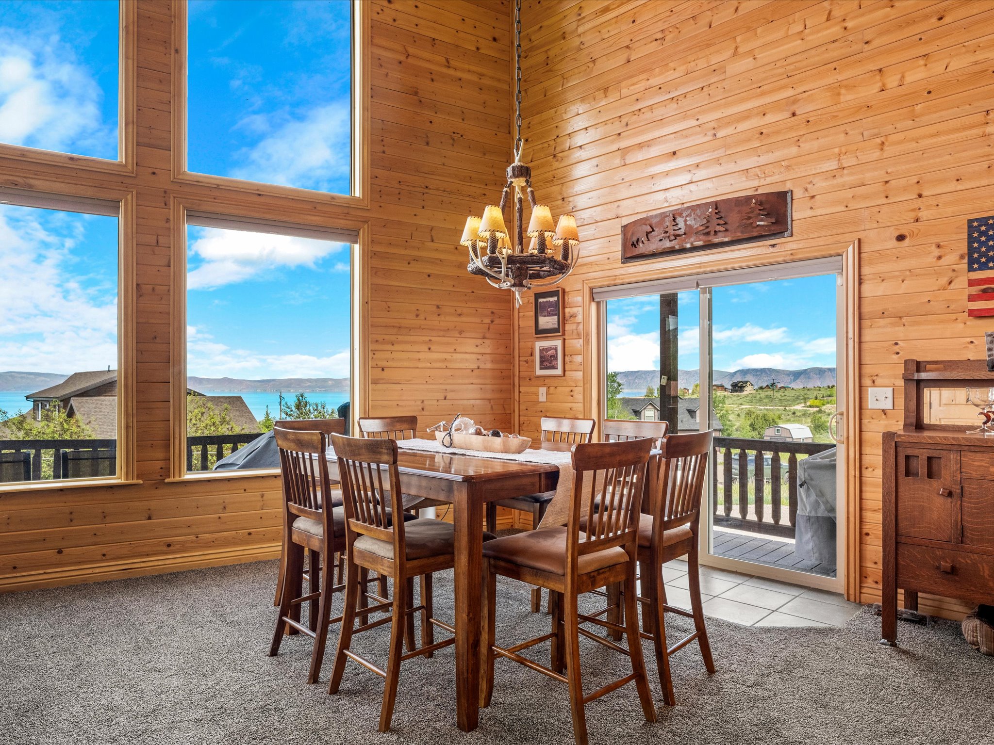 Expansive window wall with lake and landscape scenery