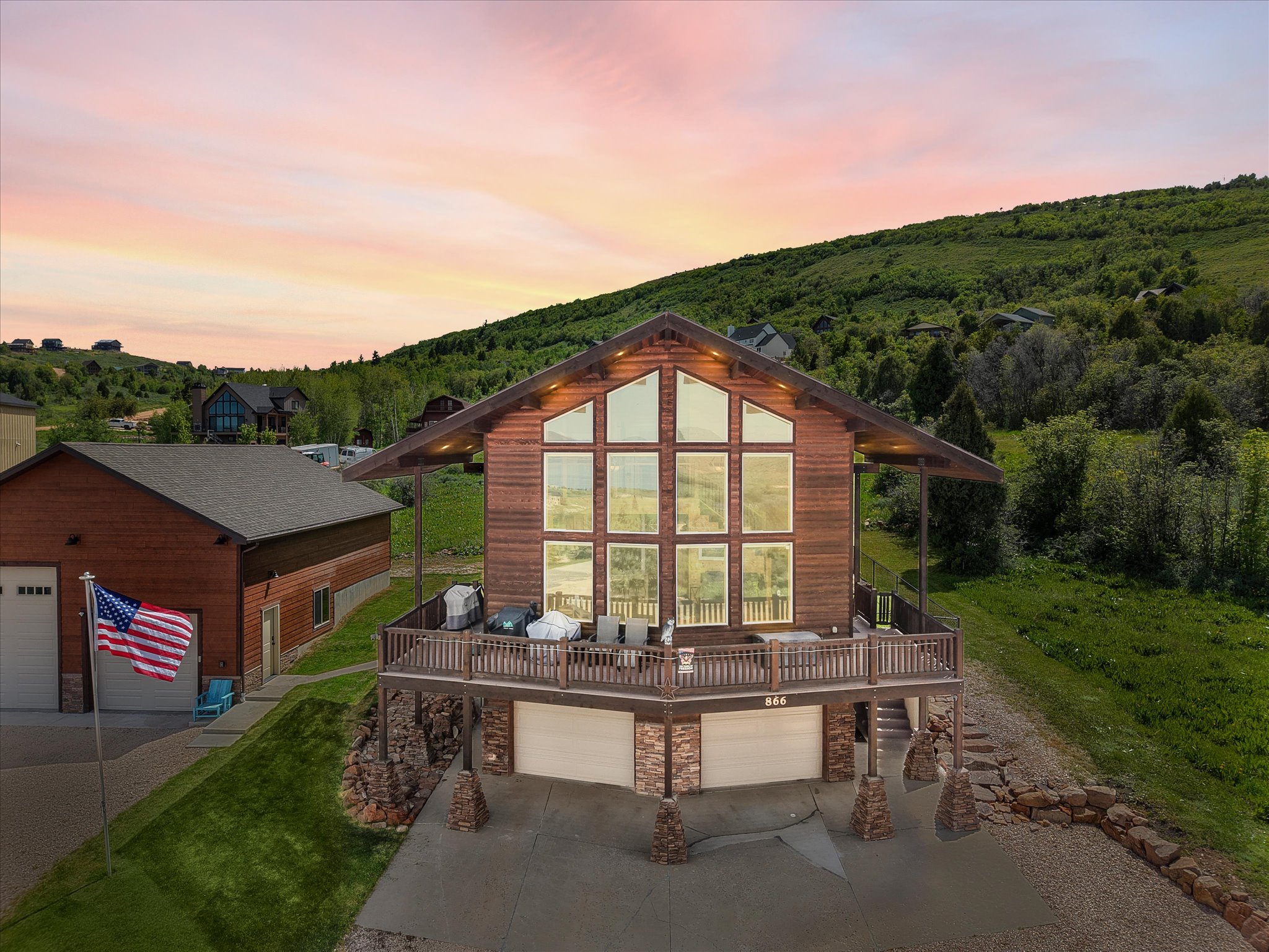 Rustic-inspired residence featuring a full wall of picture windows