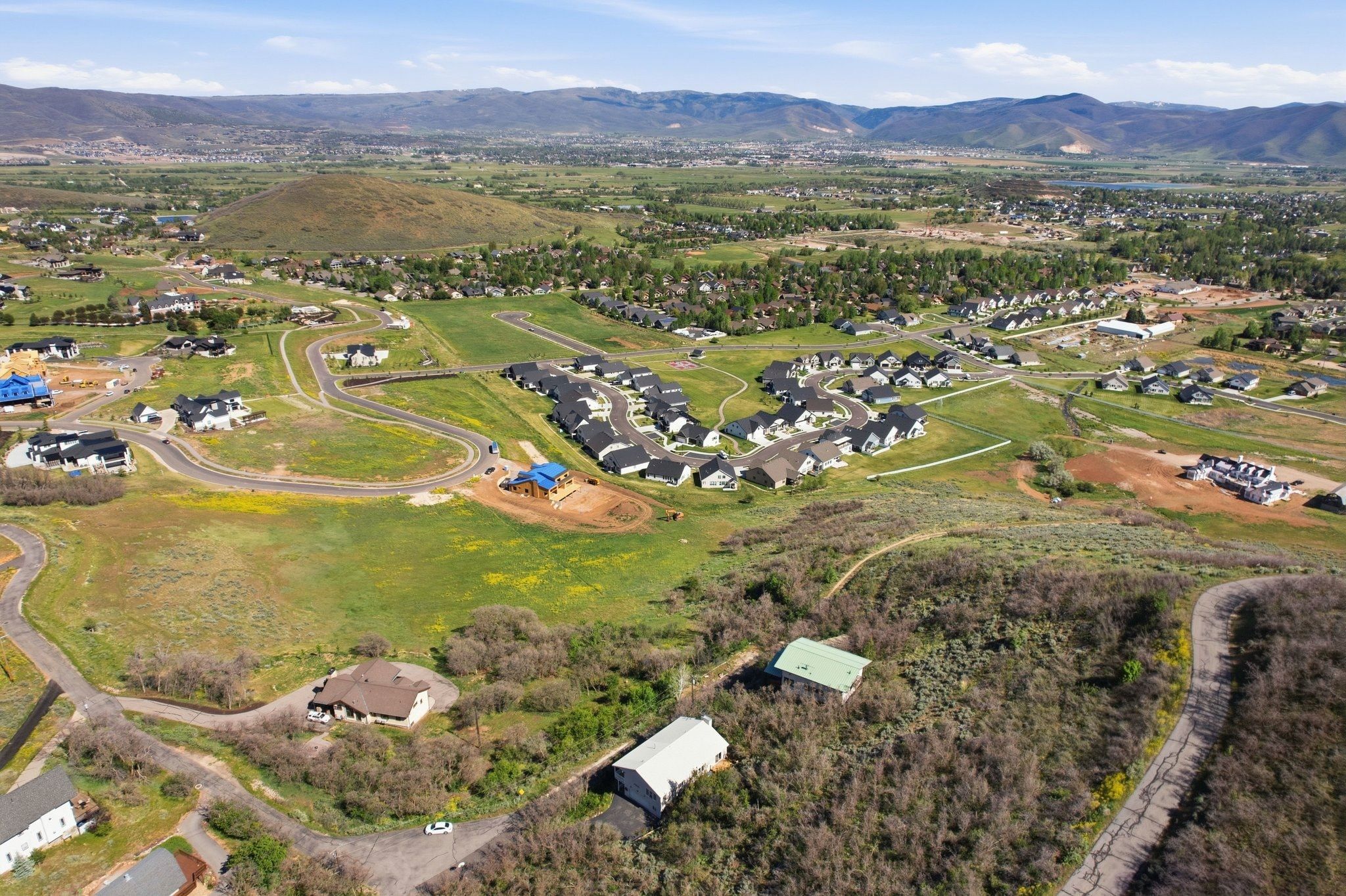 Expansive aerial showcasing a developing residential area with numerous homes
