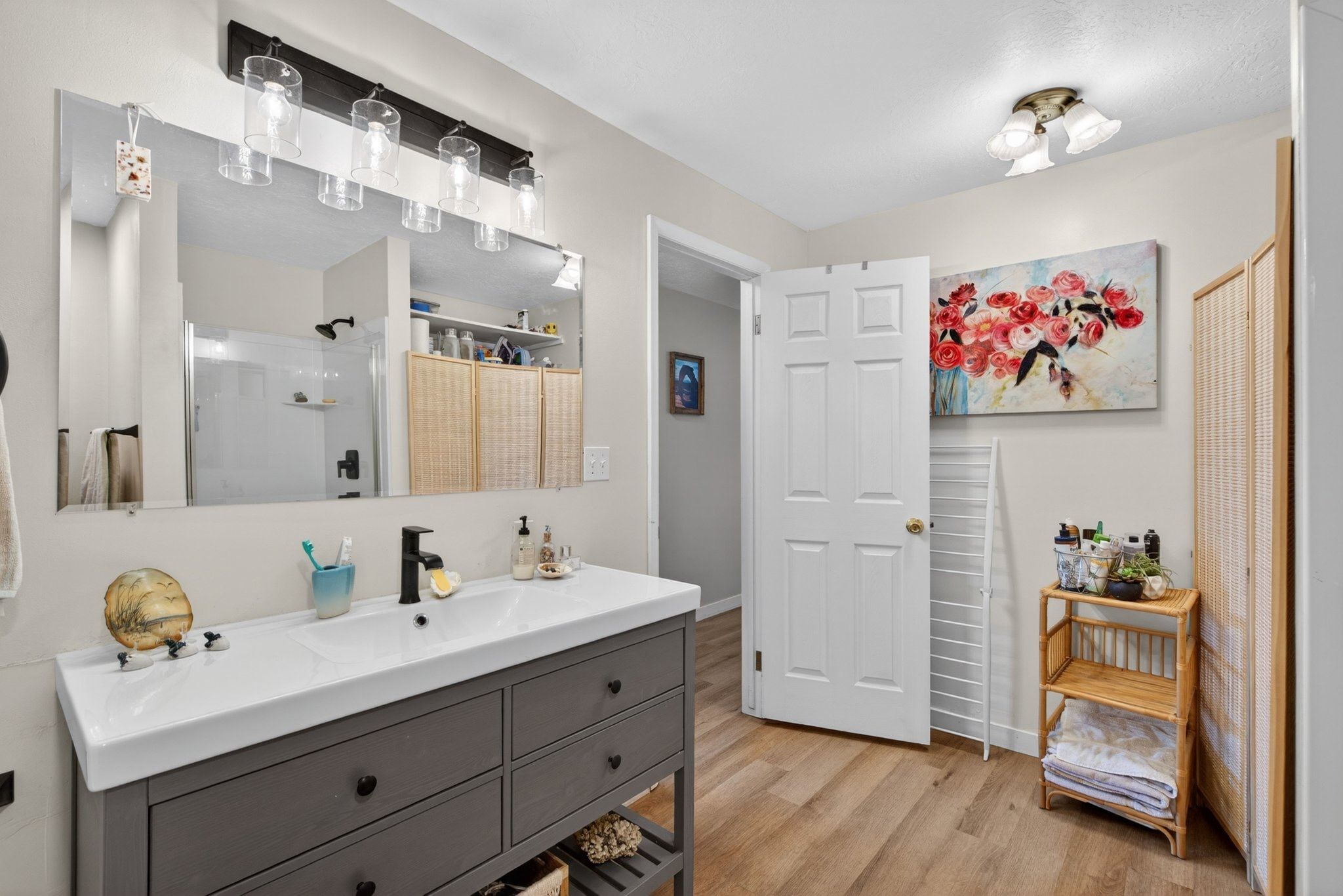 Contemporary vanity with integrated sink, matte black faucet, and ample storage