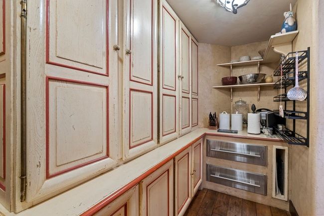 Custom cabinetry with red trim detailing