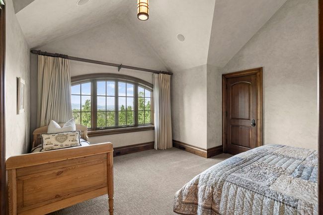 Arched picture window with scenic natural backdrop