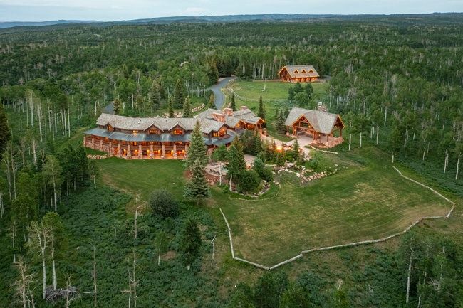 Expansive forested grounds featuring a multi-structure property
