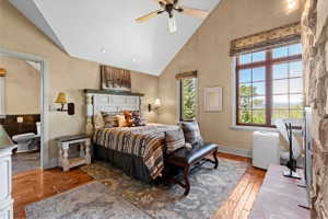 Vaulted ceilings and wood-finish flooring define this space