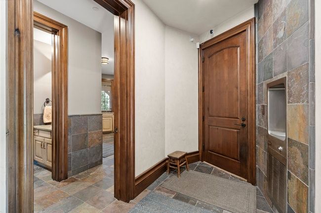 Rich wood-finish doors and trim define this hallway